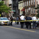 Bronx Chaos After ICE Opens Fire Police gathered at an urban crime scene.