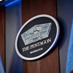 First Military Execution In 60 Years The Pentagon emblem between two flags.