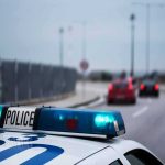 City Probe Slams Mayor, Harassment – But She’s Still In Charge Police car with blue lights on near a roadway