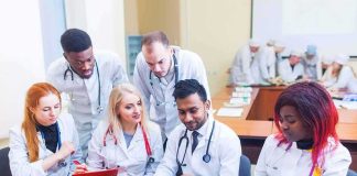 Epilepsy Pill Revives Worn Joints Group of medical students collaborating around a laptop