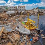 Marine Vet, Boat Ambush, Death Penalty Push Coastal town marina destroyed by storm with debris and damaged boats