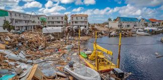 Marine Vet, Boat Ambush, Death Penalty Push Coastal town marina destroyed by storm with debris and damaged boats