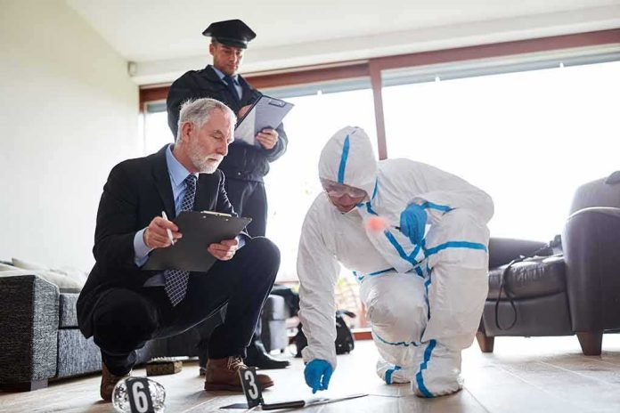 shutterstock_1455188570-2 Forensic investigator collects evidence as police and detective observe