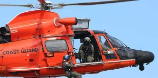 Coast Guard Scrambles After Jet Disappears Rescue helicopter with crew performing hoist operation