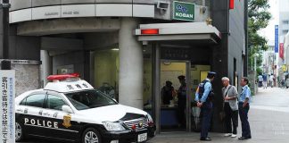 Oxford Crackdown Explodes After Student Tragedies Japanese police box with patrol car and officers speaking to two men