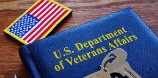 Hidden Hormone Twist in Veteran Diagnoses VA folder with house keychain and US flag patch on wooden desk