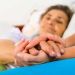 Mushrooms Jolt Alzheimer’s – Speech Returns Overnight Caregiver holding hands with an elderly patient in bed