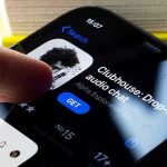 Smartphone screen showing Clubhouse app page with a finger about to tap Get