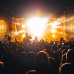 Mic Drop: Wynonna Pushes Back Crowd at a nighttime concert with bright stage lights