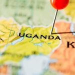 Race Against Ebola Begins Map of Uganda with a red pushpin marking the location