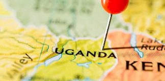 Race Against Ebola Begins Map of Uganda with a red pushpin marking the location