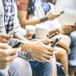 Masked Calls Terrorize High-Profile Family Group of people sitting and using smartphones